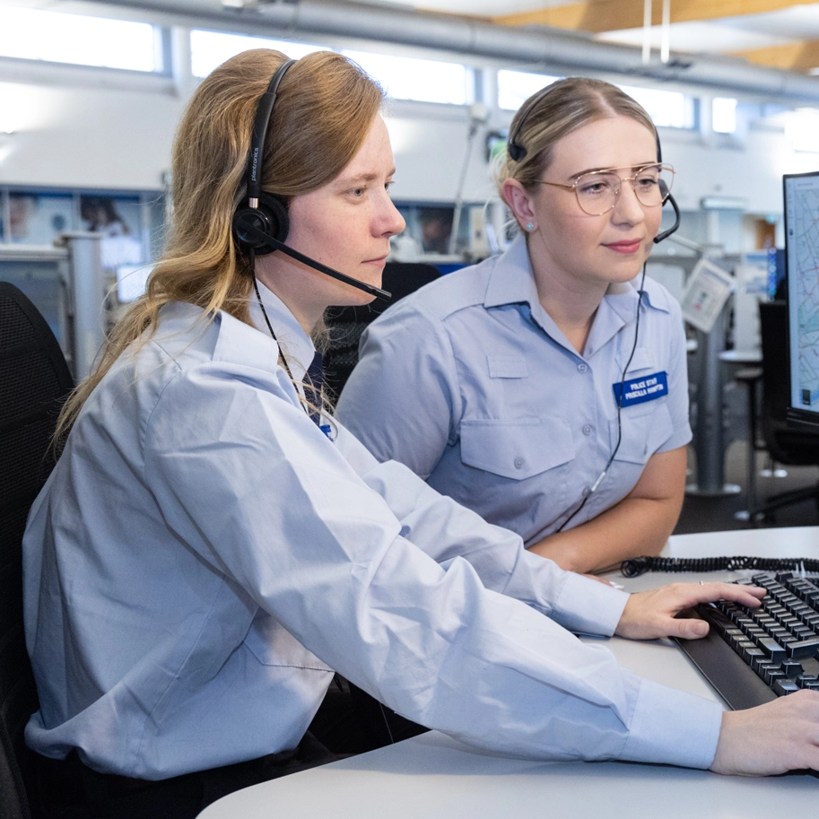 MET staff looking at screen