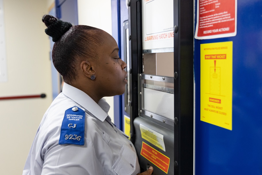 DDO officer reading notice board